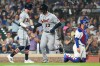 Detroit Tigers' Dillon Dingler (13) celebrates with Kerry Carpenter, left, after hitting a solo home run during the eighth inning of a baseball game against the Chicago Cubs in Chicago, Monday, July 20, 2026. (AP Photo/Nam Y. Huh)
