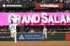 Seattle Mariners' Cal Raleigh jogs the bases after hitting a grand slam as Cincinnati Reds second baseman Edwin Arroyo (2) looks on during the seventh inning of a baseball game, Monday, July 20, 2026, in Seattle. (AP Photo/Lindsey Wasson)