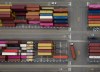 A shipping container is moved on a trailer as others sit stacked at Global Container Terminals' Deltaport facility, at Roberts Bank in Delta, B.C., on Thursday, July 16, 2026. THE CANADIAN PRESS/Darryl Dyck