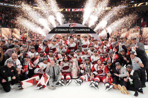 The Carolina Hurricanes pose for photos after a win over the Vegas Golden Knights in Game 6 of the NHL hockey Stanley Cup Final series, June 14, 2026, in Las Vegas. (AP Photo/John Locher, File)