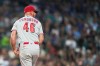 Cincinnati Reds relief pitcher Caleb Ferguson reacts in the seventh inning of a baseball game against the Seattle Mariners, Monday, July 20, 2026, in Seattle. (AP Photo/Lindsey Wasson)