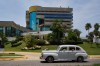 An antique car passes the Melia Habana Hotel in Havana, Cuba, Tuesday, July 21, 2026. (AP Photo/Ramon Espinosa)