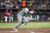 Athletics' Joshua Kuroda-Grauer starts to run after hitting a single against the Arizona Diamondbacks in the fifth inning of a baseball game, Monday, July 20, 2026, in Phoenix. (AP Photo/Rick Scuteri)