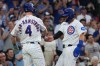 Chicago Cubs' Pete Crow-Armstrong, left, greets Seiya Suzuki, right, after they scored against the Detroit Tigers during the first inning of a baseball game Tuesday, July 21, 2026, in Chicago. (AP Photo/David Banks)