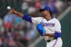 Texas Rangers starting pitcher Kumar Rocker throws during the first inning of a baseball game against the against the Chicago White Sox, Tuesday, July 21, 2026, in Arlington, Texas. (AP Photo/LM Otero)