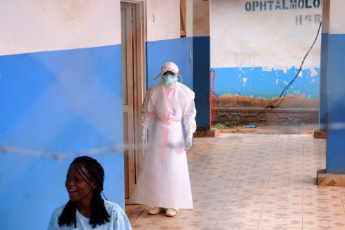 A health worker stands outside at Ebola Treatment Center at Bunia General Hospital in Ituri, Congo, Wednesday, July 22, 2026. (AP Photo/Dirole Lotsima Dieudonne)