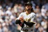 Pittsburgh Pirates pitcher Carmen Mlodzinski reacts after giving up a three-run home run to New York Yankees' Ben Rice in the seventh inning during the first baseball game of a doubleheader, Wednesday, July 22, 2026, in New York. (AP Photo/Adam Hunger)