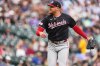 Washington Nationals starting pitcher Cade Cavalli reacts after striking out Colorado Rockies' Kyle Karros to end the sixth inning of a baseball game, Wednesday, July 22, 2026, in Denver. (AP Photo/David Zalubowski)