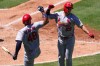 St. Louis Cardinals' JJ Wetherholt, right, is congratulated by Iván Herrera after hitting a solo home run during the sixth inning of a baseball game against the Los Angeles Angels, Wednesday, July 22, 2026, in Anaheim, Calif. (AP Photo/Mark J. Terrill)