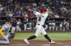 Arizona Diamondbacks' James McCann (8) watches the flight of his two-run home run as Athletics catcher Jonah Heim looks on during the fifth inning of a baseball game, Wednesday, July 22, 2026, in Phoenix. (AP Photo/Ross D. Franklin)