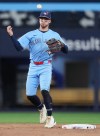 Toronto Blue Jays second baseman Ernie Clement (22) bobbles the ball against the Tampa Bay Rays during ninth inning American League MLB baseball action in Toronto on Wednesday, July 22, 2026. THE CANADIAN PRESS/Nathan Denette