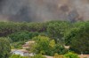 Smoke rises over wildfires in the Lège-Cap-Ferret region, western France, Thursday, July 23, 2026. (AP Photo/Caroline Blumberg)