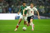 England's Elliot Anderson runs with the ball ahead of Mexico's Raul Jimenez during the World Cup round of 16 soccer match between Mexico and England in Mexico City, Sunday, July 5, 2026. (AP Photo/Silvia Izquierdo)