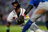 FILE - Atlanta Braves' Ronald Acuña Jr. (13) steals third base against Toronto Blue Jays third baseman Kazuma Okamoto (7) in the fifth inning of a baseball game on June 3, 2026, in Atlanta. (AP Photo/Mike Stewart, File)