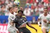 Canada's Jonathan David (10) and Morocco's Neil El Aynaoui (24) battle for the ball during the World Cup round of 16 soccer match between Canada and Morocco in Houston, Saturday, July 4, 2026. (AP Photo/Ashley Landis)