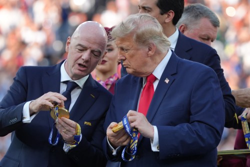 FIFA President Gianni Infantino, left, and President Donald Trump comment on the medals as they wait to congratulate the Spanish players after the World Cup final soccer match between Spain and Argentina in East Rutherford, N.J., near New York, Sunday, July 19, 2026. (AP Photo/Jacquelyn Martin)
