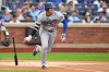 Los Angeles Dodgers' Shohei Ohtani runs to first base for a single during the first inning of a baseball game against the New York Mets Friday, July 24, 2026, in New York. (AP Photo/Frank Franklin II)