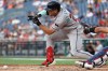 Arizona Diamondbacks' Adrian del Castillo lays down a sacrifice bunt during the second inning of a baseball game against the Washington Nationals, Friday, July 24, 2026, in Washington. (AP Photo/Daniel Kucin Jr.)