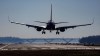 FILE - A plane lands at Ronald Reagan Washington National Airport in Arlington, Va., Dec. 30, 2022. (AP Photo/Carolyn Kaster, File)