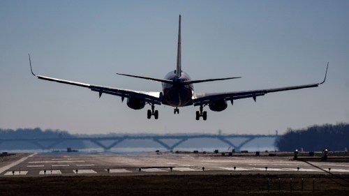 FILE - A plane lands at Ronald Reagan Washington National Airport in Arlington, Va., Dec. 30, 2022. (AP Photo/Carolyn Kaster, File)