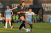 Vancouver Rise's Jessica De Filippo (left) battles with AFC Toronto's Sarah Stratigakis for the ball during the first half of an NSL match, in Burnaby, B.C., on Friday, April 24, 2026. THE CANADIAN PRESS/Rich Lam