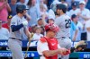 New York Yankees' Austin Wells, right, celebrates his home run with Ryan McMahon, left, as Philadelphia Phillies catcher J.T. Realmuto, center, looks over his equipment during the third inning of a baseball game, Saturday, July 25, 2026, in Philadelphia. (AP Photo/Chris Szagola)