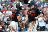 Baltimore Orioles' Pete Alonso celebrates with Baltimore Orioles' Leody Taveras after scoring a run during the third inning of a baseball game against the Atlanta Braves, Saturday, July 25, 2026, in Baltimore. (AP Photo/Daniel Kucin Jr.)