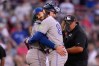 Toronto Blue Jays starting pitcher Dylan Cease embraces catcher Brandon Valenzuela after throwing a one-hitter following a baseball game against the Boston Red Sox, Saturday, July 25, 2026, in Boston. (AP Photo/Charles Krupa)
