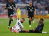 Vancouver Whitecaps FC midfield Thomas Müller (13) slides into Minnesota United FC defence Morris Duggan (23) during the first half of an MLS soccer match on Saturday, July 25, 2026, in St. Paul, Minn. (AP Photo/Adam Bettcher)