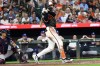Baltimore Orioles' Dylan Beavers hits an RBI single during the ninth inning of a baseball game against the Atlanta Braves, Saturday, July 25, 2026, in Baltimore. (AP Photo/Daniel Kucin Jr.)