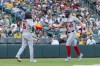 Washington Nationals' Curtis Mead (45) high-fives CJ Abrams (5) after scoring during the third inning of a baseball game against the Athletics Friday, July 17, 2026, in West Sacramento, Calif. (AP Photo/Sara Nevis)