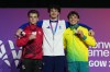 Scotland's Reuben Ward, centre, gold medal, Canada's Felix Dolci, left, silver medal and Australia's Jesse Moore, bronze medal at the men's Artistic Gymnastics all-around medal ceremony at the Commonwealth Games in Glasgow, Scotland, Sunday, July 26, 2026. (AP Photo/Eranga Jayawardena)