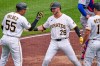 Pittsburgh Pirates' Ryan O'Hearn (29) celebrates with Esmerlyn Valdez (55) and Bryan Reynolds, right, after hitting a grand slam off Chicago Cubs pitcher Jameson Taillon during the third inning of a baseball game in Pittsburgh, Sunday, July 26, 2026. (AP Photo/Gene J. Puskar)