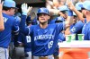 Kansas City Royals' Michael Massey (19) is congratulated by teammates after hitting a two-run home run during the eighth inning of a baseball game against the Detroit Tigers, Sunday, July 26, 2026, in Detroit. (AP Photo/Jose Juarez)