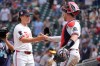 Minnesota Twins relief pitcher Travis Adams, left, celebrates with catcher Ryan Jeffers, right, after a baseball game against the Athletics, Sunday, July 26, 2026, in Minneapolis. (AP Photo/Bruce Kluckhohn)