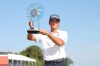 Jackson Koivun holds his trophy after winning the 3M Open golf tournament at the Tournament Players Club Sunday, July 26, 2026, in Blaine, Minn. (AP Photo/Bailey Hillesheim)