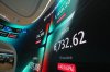 The screens show the Korea Composite Stock Price Index (KOSPI) and the foreign exchange rate between U.S. dollar and South Korean won at a dealing room of Hana Bank in Seoul, South Korea, Monday, July 27, 2026. (AP Photo/Lee Jin-man)
