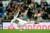 FILE - Real midfielder Luka Modric, left, tries to stop Ajax's Dusan Tadic during the Champions League round of 16 second leg soccer match between Real Madrid and Ajax at the Santiago Bernabeu stadium in Madrid, Tuesday, March 5, 2019. (AP Photo/Bernat Armangue, file)