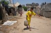 Displaced Palestinian children carry refilled water containers in Deir al-Balah, central Gaza Strip, on Saturday, July 4, 2026. (AP Photo/Abdel Kareem Hana)