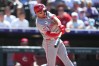 Cincinnati Reds' Spencer Steer connects for a double off Colorado Rockies relief pitcher Brennan Bernardino in the eighth inning of a baseball game Saturday, July 18, 2026, in Denver. (AP Photo/David Zalubowski)