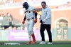 San Francisco Giants' Casey Schmitt, left, walks off the field with an injury accompanied by athletic trainer Dave Groeschner, right, during the second inning of a baseball game against the Milwaukee Brewers in San Francisco, Monday, July 27, 2026. (AP Photo/Jed Jacobsohn)