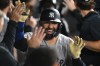 New York Yankees' Ali Sanchez celebrates with teammates in the dugout after hitting a three-run home run during the eighth inning of a baseball game against the Chicago White Sox in Chicago, Monday, July 27, 2026. (AP Photo/Paul Beaty)