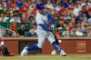 Chicago Cubs' Alex Bregman hits an RBI double during the first inning of a baseball game against the St. Louis Cardinals, Monday, July 27, 2026, in St. Louis. (AP Photo/Scott Kane)