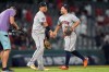 Houston Astros' Jose Altuve (27) and Isaac Paredes (15) celebrate their win over the Los Angeles Angels during a baseball game Monday, July 27, 2026, in Anaheim, Calif. (AP Photo/Scott Strazzante)