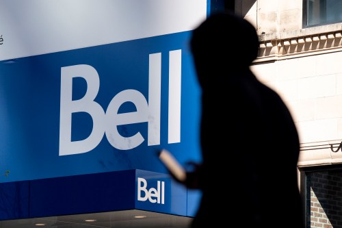 People walk bast a Bell store in downtown Montreal on Wednesday, May 7, 2025. THE CANADIAN PRESS/Christopher Katsarov