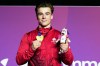 Felix Dolci of Canada poses for a photograph with his gold medal after winning the Men's Vault final of Artistic Gymnastics at the Commonwealth Games in Glasgow, Scotland, Tuesday, July 28, 2026. (AP Photo/Manish Swarup)