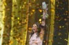 Dara from Bulgaria holds up the trophy after winning the Grand Final of the 70th Eurovision Song Contest in Vienna, Austria, Sunday, May 17, 2026. (AP Photo/Martin Meissner)