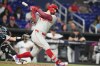 Philadelphia Phillies' Kyle Schwarber strikes out swinging during the third inning of a baseball game against the Miami Marlins, Monday, July 27, 2026, in Miami. (AP Photo/Lynne Sladky)
