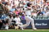 Milwaukee Brewers' Jake Bauers hits an RBI groundout during the first inning of a baseball game against the Colorado Rockies, Sunday, July 26, 2026, in Milwaukee. (AP Photo/Aaron Gash)