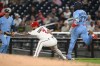 Toronto Blue Jays' Vladimir Guerrero Jr. (27) is safe at first base against Washington Nationals first baseman Luis Garcia Jr. (2) during the third inning of a baseball game, Tuesday, July 28, 2026, in Washington. (AP Photo/Nick Wass)